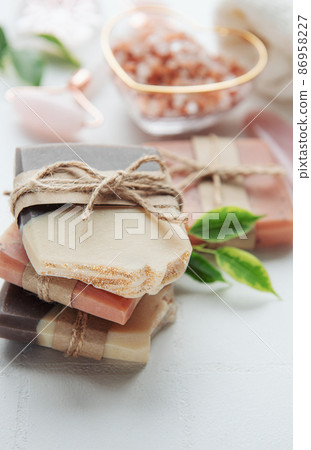 Handmade soap bars and green leaves Handmade soap bars and green leaves 86958227