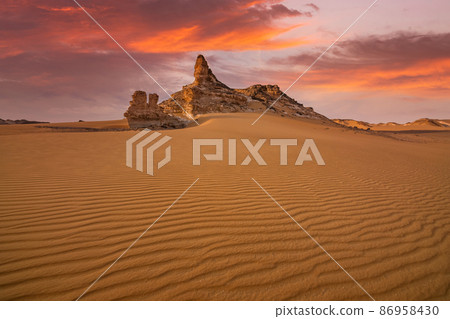 Chalk rocks in the White Desert at sunset. Egypt, Baharia Chalk rocks in the White Desert at sunset. Egypt, Baharia 86958430