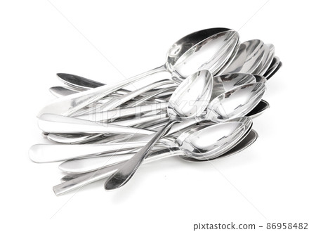 Pile of metal spoons 86958482
