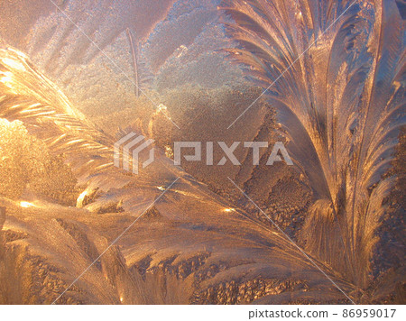 Natural ice pattern and sunlight close-up on window glass Natural ice pattern and sunlight close-up on window glass 86959017