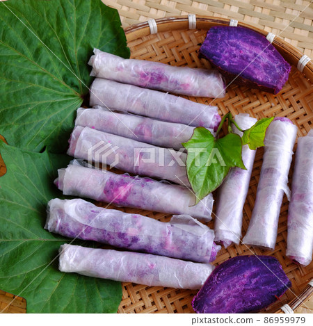 Vietnamese homemade food, vegan spring roll from violet sweet potato Vietnamese homemade food, vegan spring roll from violet sweet potato 86959979