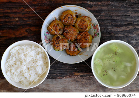 bitter melon stuffed with tofu, mushroom cook with sauce 86960074