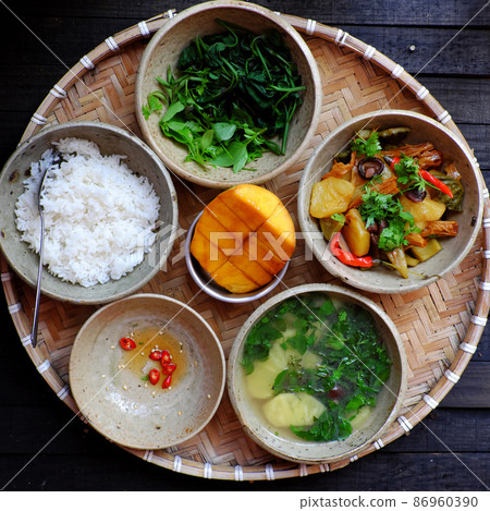 tray of rice dish with boiled sweet potato buds, pineapple soup, tofu skin, mushrooms cook with sauce 86960390