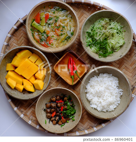vegan tray of rice dish with fried chayote, sour soup, straw mushrooms cook with sauce 86960401