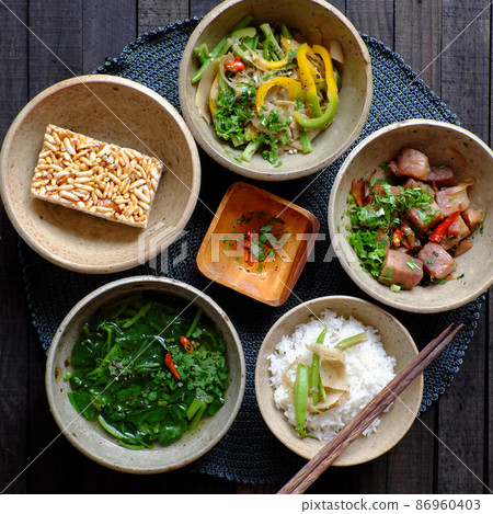 Vietnamese vegan food, rice bowl, fried bell pepper, young jackfruit cook with sauce, spinach soup 86960403