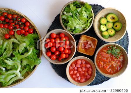 Vietnamese healthy food with vegan ingredient, salad mix with tomato sauce, strawberry, avocado Vietnamese healthy food with vegan ingredient, salad mix with tomato sauce, strawberry, avocado 86960406