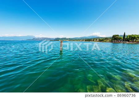 Panoramic view of Lake Garda from the Bardolino Village - Verona Veneto Italy Panoramic view of Lake Garda from the Bardolino Village - Verona Veneto Italy 86960736