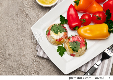 Portion of delicious chicken aspic on a plate isolated on concrete table 86961003