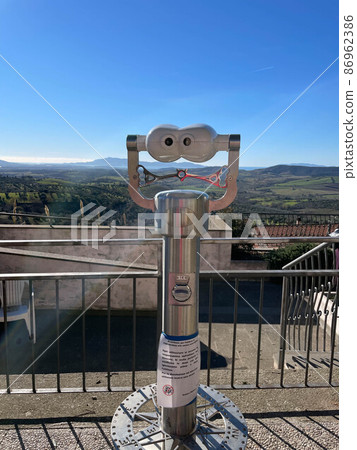 panoramic binoculars placed at the top of the town, for the view of landscapes, skyline and urban landmarks. tourist tour during the trip to Tuscany to discover landscapes, architecture and historic panoramic binoculars placed at the top of the town, for the view of landscapes, skyline and urban landmarks. tourist tour during the trip to Tuscany to discover landscapes, architecture and historic 86962386