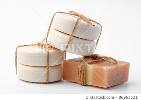 Soap bars tied with twine on white background Soap bars tied with twine on white background 86963521