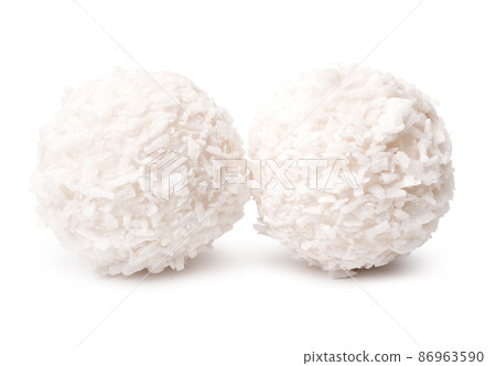 Sweet round coconut candy isolated on white Sweet round coconut candy isolated on white 86963590