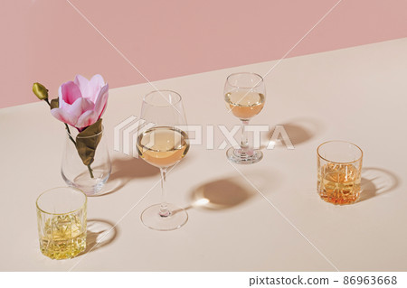 Assorted beverages served in stylish glasses with flower Assorted beverages served in stylish glasses with flower 86963668