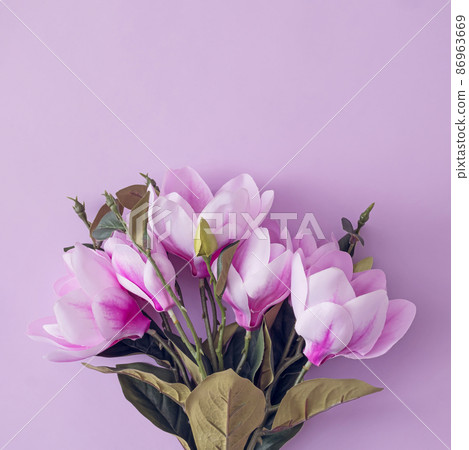 Bouquet of purpke flowers on a matching background 86963669