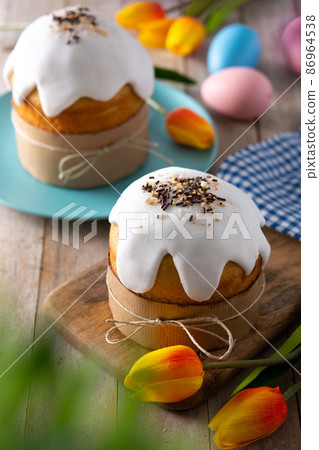 Traditional Easter cake, colorful eggs and tulips 86964538