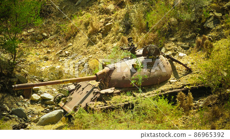Abandoned tank at the road in Filfil national park in Eritrea Abandoned tank at the road in Filfil national park in Eritrea 86965392