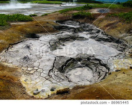 view to mud volcanos inside Caldera of Uzon Volcano, Kamchatka, Russia view to mud volcanos inside Caldera of Uzon Volcano, Kamchatka, Russia 86965445