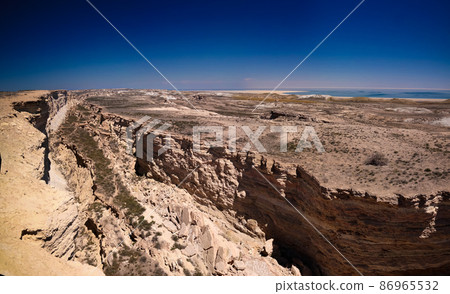 Panorama view to Aral sea from the rim of Plateau Ustyurt near Duana cape , Karakalpakstan, Uzbekistan Panorama view to Aral sea from the rim of Plateau Ustyurt near Duana cape , Karakalpakstan, Uzbekistan 86965532