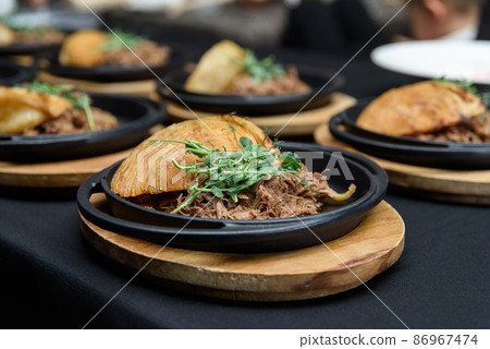 Plate of tasty Swiss dish with venison and cabbage served with herbs and flower petals 86967474