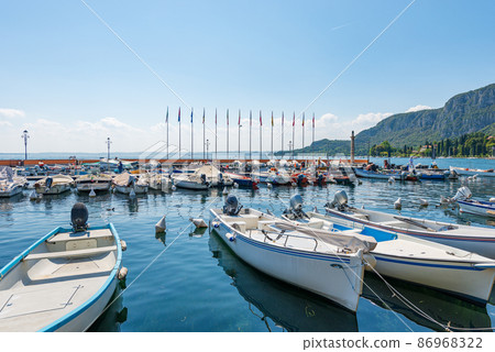 Small Port of Lake Garda with Many Boats Moored - Garda Town Veneto Italy 86968322