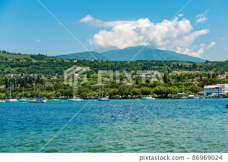 Coast of Lake Garda and Mountain Range of Monte Baldo - Bardolino Italy 86969024