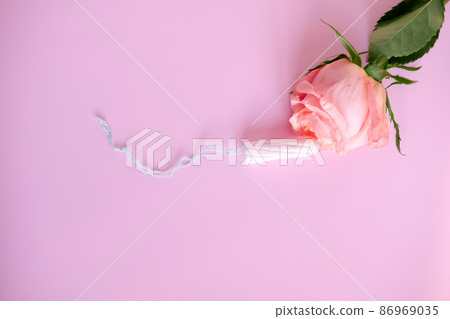 white tampon and pink rose, On a pink background,copy space 86969035