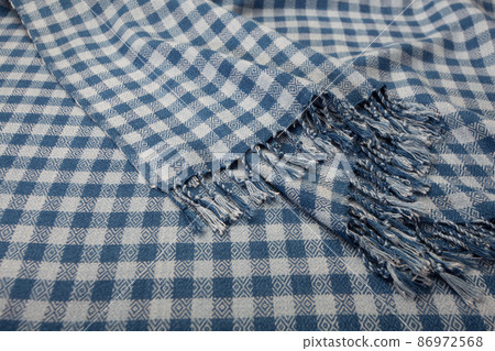 Close up of texture of hand woven plaid shawl Close up of texture of hand woven plaid shawl 86972568