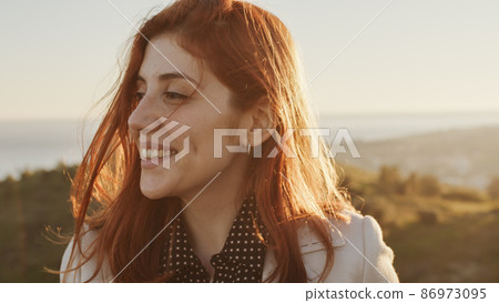 Beautiful girl with white dress explores and smile an ancient Italian castle Beautiful girl with white dress explores and smile an ancient Italian castle 86973095