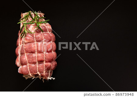 boneless pork shoulder in web decorated rosemary boneless pork shoulder in web decorated rosemary 86973948