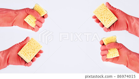Hands in rubber gloves with cleaning sponge on white background Hands in rubber gloves with cleaning sponge on white background 86974015