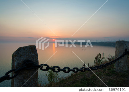 Sunset landscape at Cape Kaliakra, Bulgaria, Eastern Europe - selective focus, space for text Sunset landscape at Cape Kaliakra, Bulgaria, Eastern Europe - selective focus, space for text 86976191