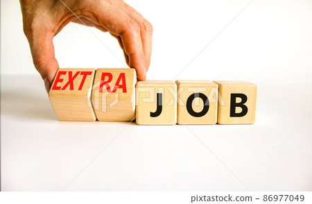 Extra job symbol. Businessman turns wooden cubes and changes concept words Job to Extra job. Beautiful white table white background, copy space. Business extra job concept. Extra job symbol. Businessman turns wooden cubes and changes concept words Job to Extra job. Beautiful white table white background, copy space. Business extra job concept. 86977049