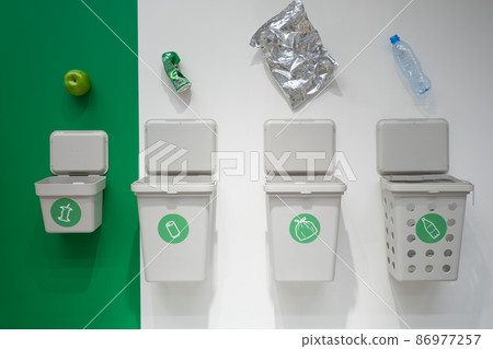Garbage cans for separate garbage collection. Food waste tank, paper trash, plastic waste tank and metal can tank. The concept of environmental conservation 86977257