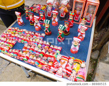 A stall selling souvenirs in Tianlong Tunbao Ancient Town, Guizhou, China A stall selling souvenirs in Tianlong Tunbao Ancient Town, Guizhou, China 86980515