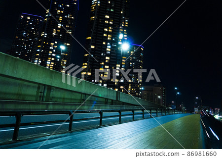 Night view of tower apartments along the river in the city center_30 86981660