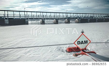 Frozen lake outside of the dam 86982655