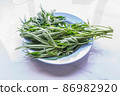 Marijuana herb plant on the plate. 86982920