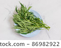 Marijuana herb plant on the plate. 86982922