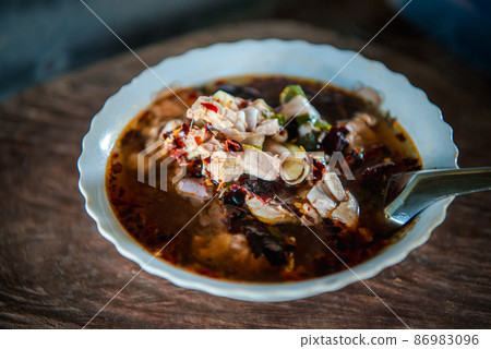 Hot and sour meat soup (Tom Yum) pork or chicken Hot and sour meat soup (Tom Yum) pork or chicken 86983096