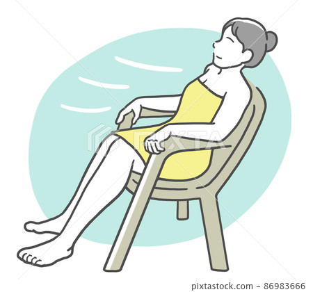 A young woman wrapped in a buzz towel, sitting on a chair and enjoying an open air bath 86983666
