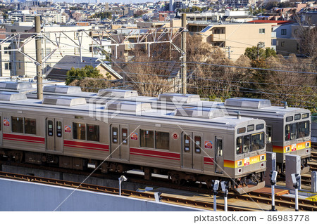 Metropolitan area commuter train waiting at Tokyu Saginuma garage Metropolitan area commuter train waiting at Tokyu Saginuma garage 86983778