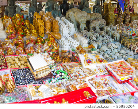 Souvenirs lined up at the stalls of the ruins of Nalanda Buddhist University, India 86986204