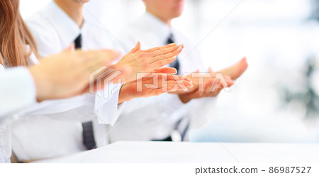 Close-up of business people clapping hands. Business seminar concept Close-up of business people clapping hands. Business seminar concept 86987527