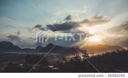 Morning view of mountain landscape with fog on sky and clouds background in Phatthalung province, Southern of Thailand. Morning view of mountain landscape with fog on sky and clouds background in Phatthalung province, Southern of Thailand. 86989266