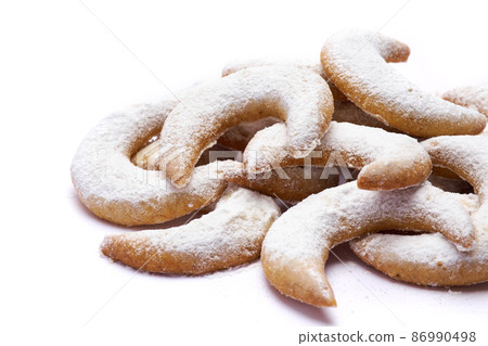 Traditional German or Austrian Vanillekipferl vanilla kipferl cookies isolated on white background Traditional German or Austrian Vanillekipferl vanilla kipferl cookies isolated on white background 86990498