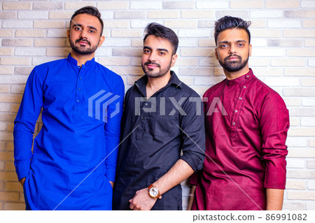 friends from india talking in living room and have fun friends from india talking in living room and have fun 86991082