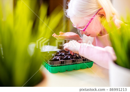blonde albino young little farmer planting at home blonde albino young little farmer planting at home 86991213