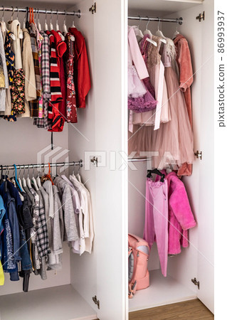 Female childish wardrobe apparel hanged comfortable vertical storage Marie Kondo minimalist method Female childish wardrobe apparel hanged comfortable vertical storage Marie Kondo minimalist method 86993937