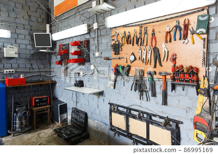 A set of tools in the real auto repair shop. 86995169
