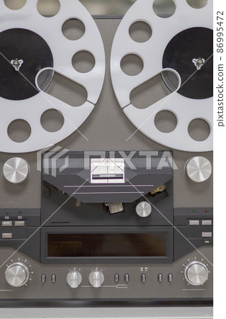 Old soviet tape recorder. Retro item from the times of the USSR. Closeup photo Old soviet tape recorder. Retro item from the times of the USSR. Closeup photo 86995472