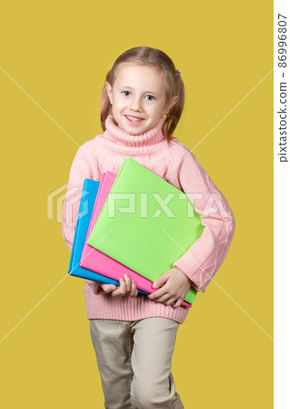 Portrait of happy elementary age school girl smiling and looking at the camera 86996807